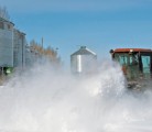 Heavier than normal snowfall in much of Manitoba and Saskatchewan is setting off flood alarms this spring, but it has also kept farmers busy. Gerard Zdunich cleared snow in his farmyard east of Kenaston, Sask., March 25. | William DeKay photo