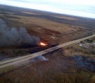 A derailed train containing LPG and crude oil burns near Gainford, Atal. | RCMP photo