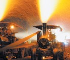 A shower of fire is created as the steam engines are fed a late night diet of wood shavings during the Mount Pleasant, Iowa, antique power event. The Reeves is on the left. | Carlberg family photo