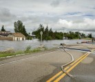 Residents of Fenwood try to pump out the town. Laurie Stopa, a resident of the town said a neighbour woke him up at 4 a.m. on June 30. He said the water was juststarting to run into the town, and within two hours his house was flooded. | Robin Booker photo