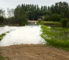 Flood water run over the lane of a farm south of Foam Lake, Sask. | Robin Booker photo