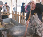 Colten Snyder, left, and Bryan Keller make kettle corn, a popular concession item at Honeysuckle Hill Farm near Springfield, Tenn. The agribusiness hosts about 15,000 schoolchildren and offers zombie paintball, a zip line and petting farm. | Karen Morrison photo